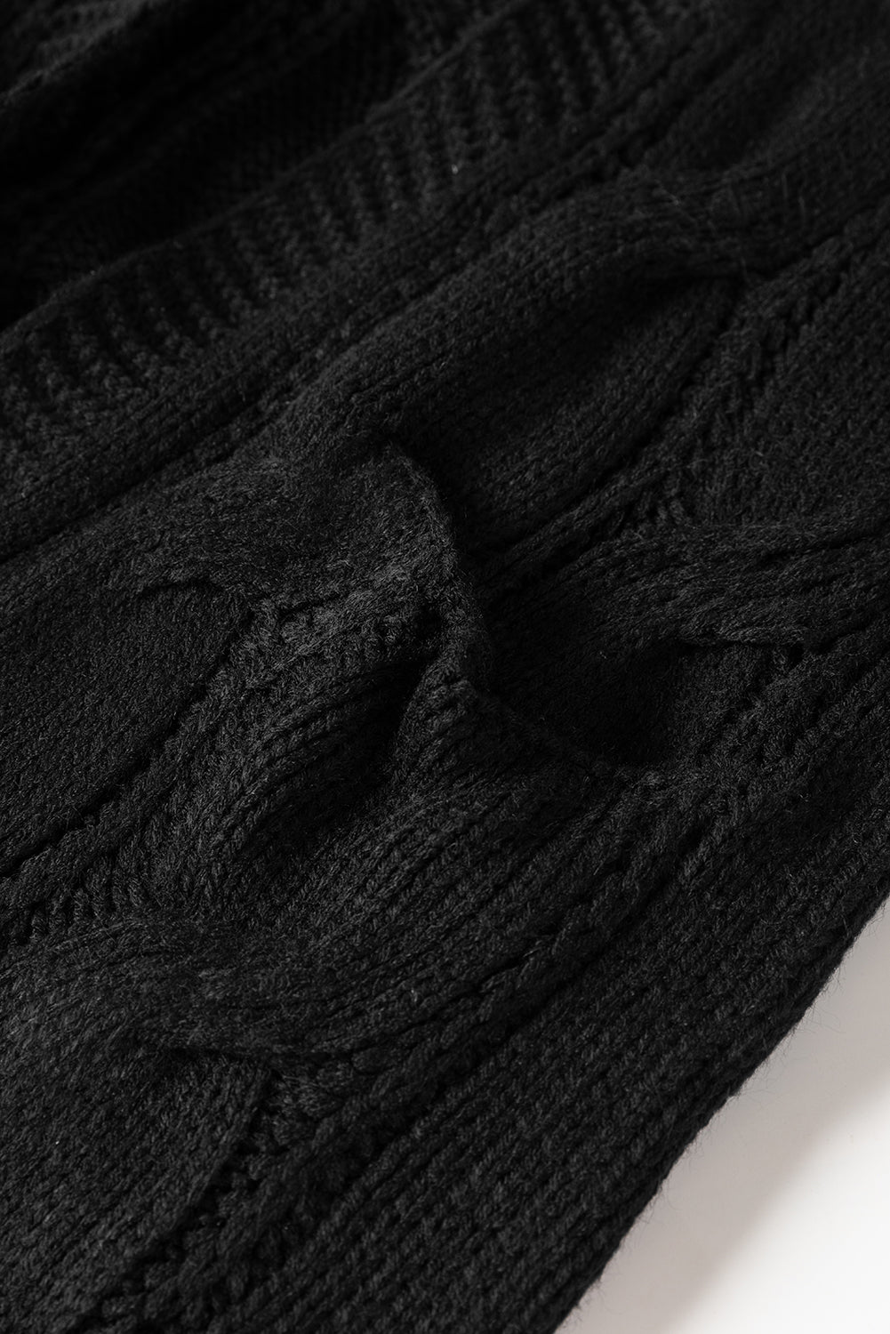 Cardigan noir en maille torsadée à œillets et bordures côtelées