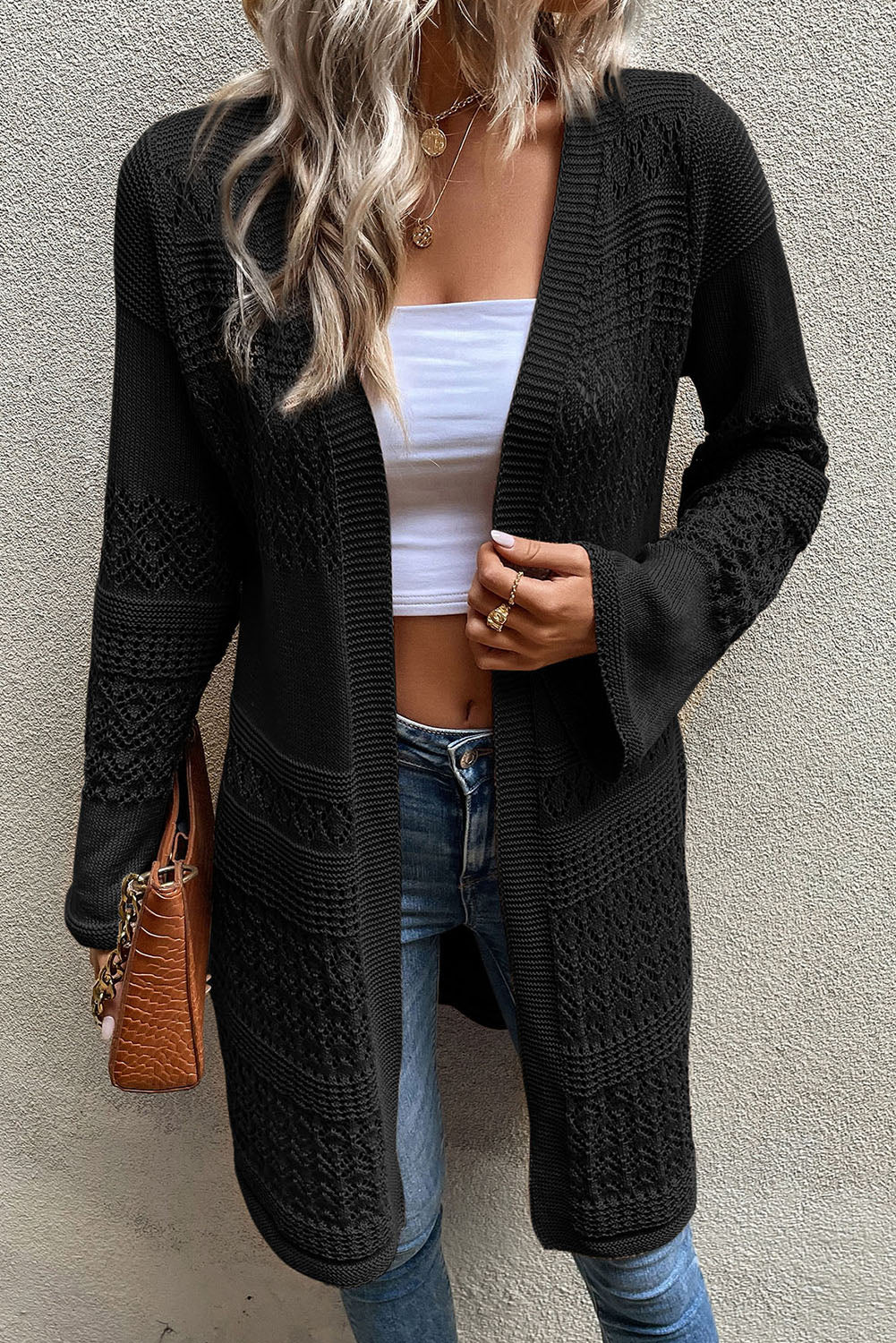 Cardigan noir ouvert sur le devant en maille pointelle