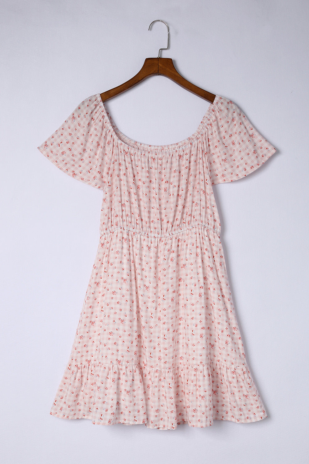 Robe florale rose à taille élastique et ourlet à volants