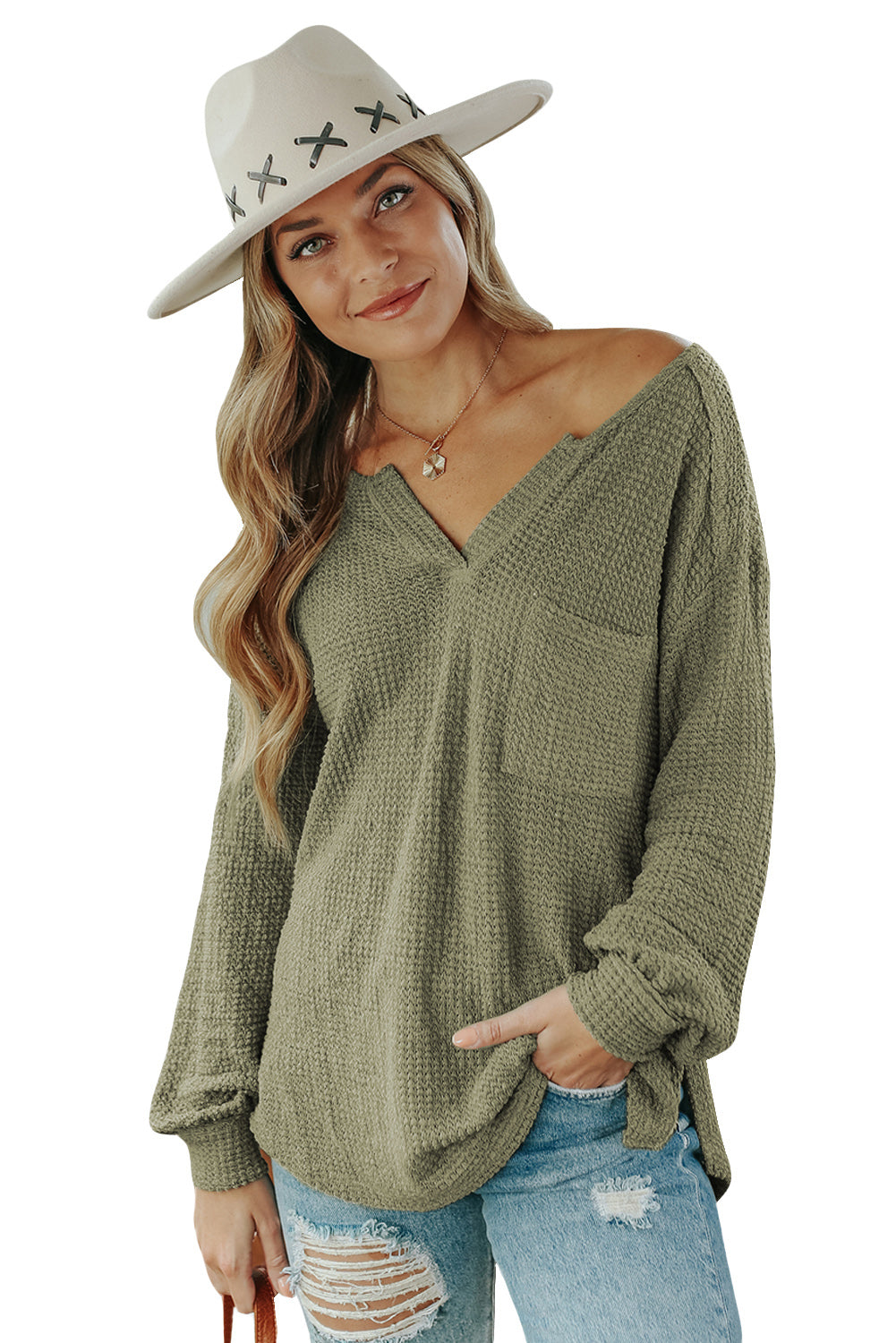 Haut ample beige en tricot gaufré avec poches et col fendu