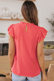 Blouse texturée froissée rose à manches bouffantes et à volants