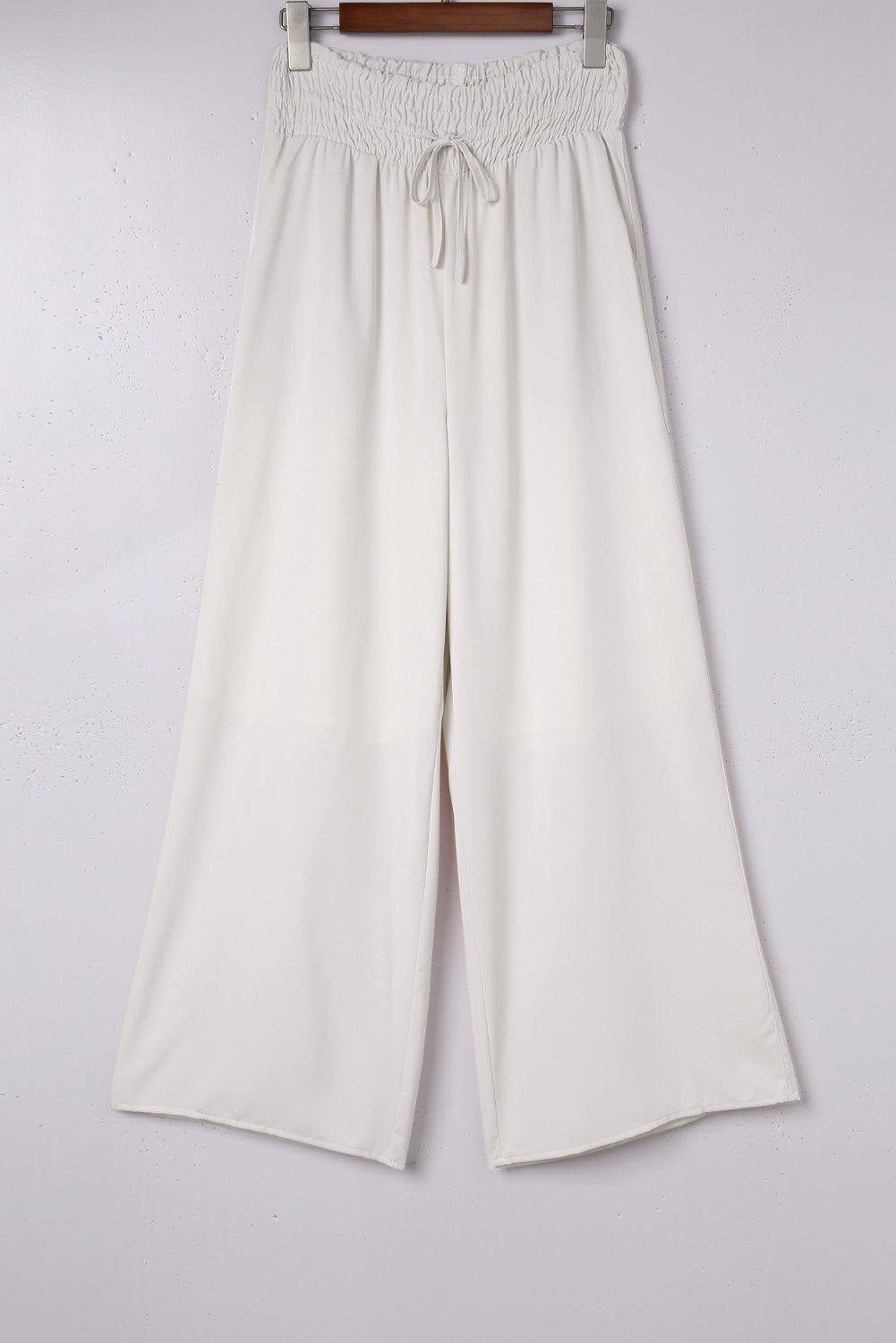 Pantalon large smocké beige taille haute 