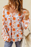 Blouse dolman orange fendue à col en V et imprimé floral 