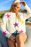 Pull ample blanc à motif d'étoiles colorées