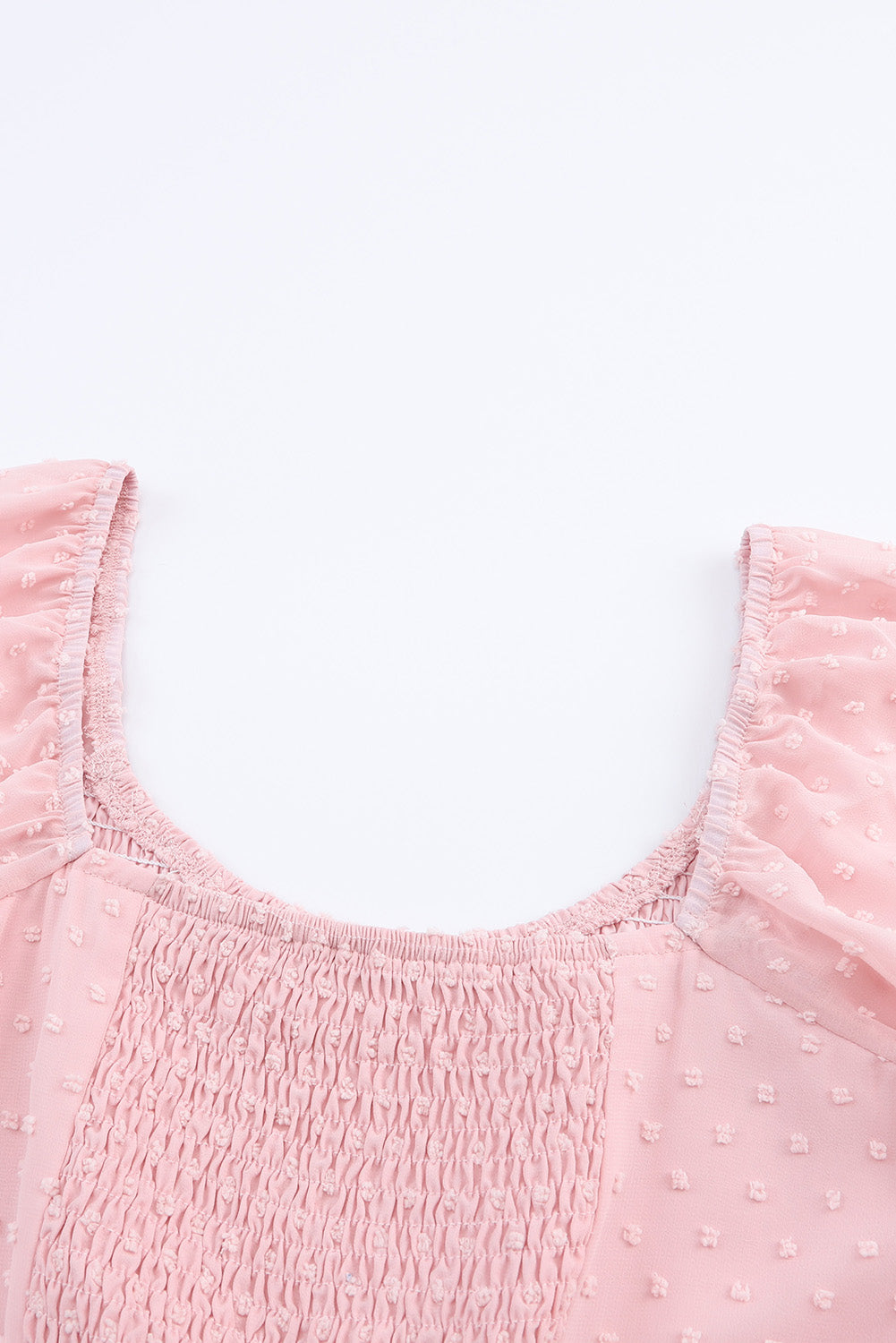 Mini-robe smockée rose à manches bouffantes et pois suisses