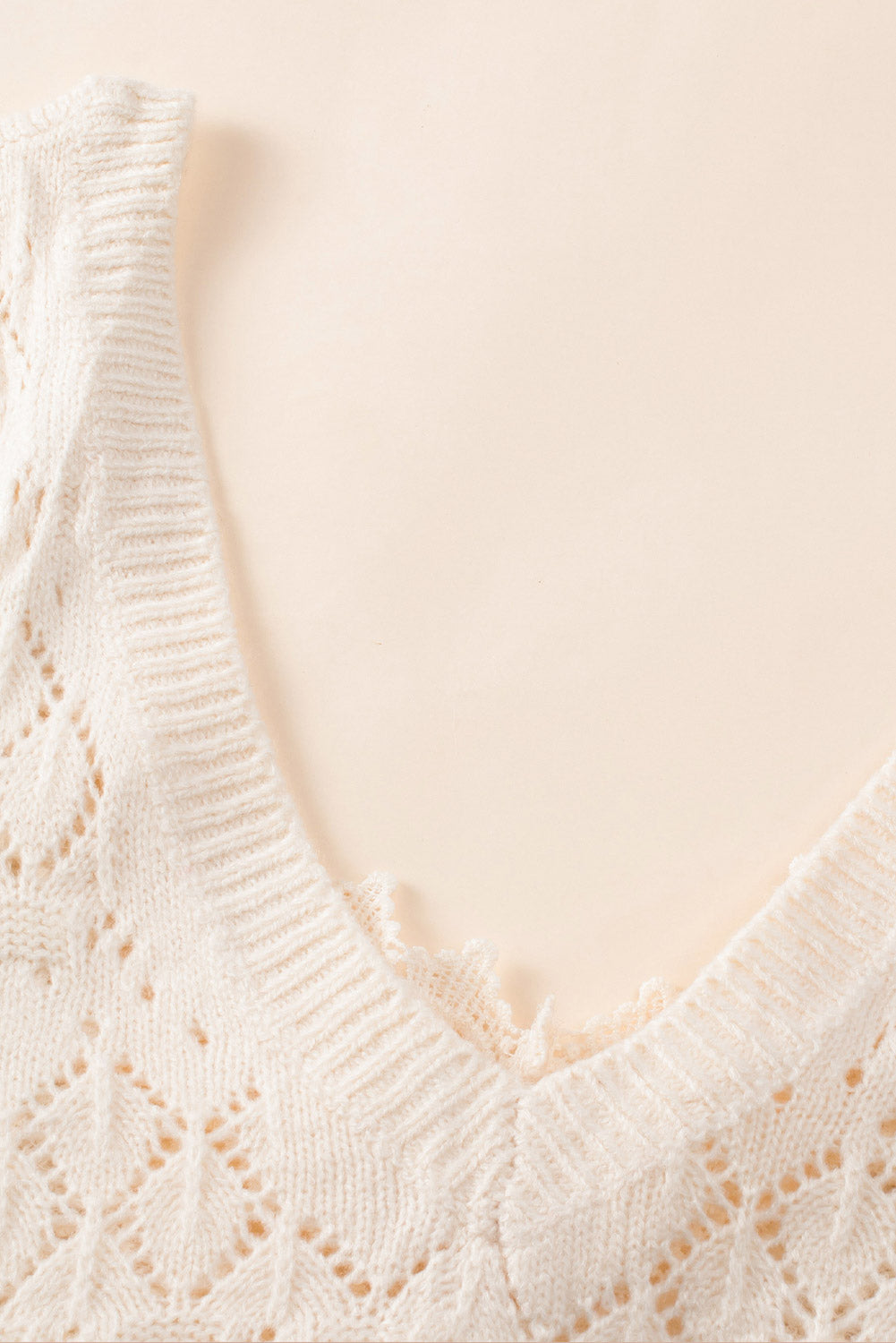 Pull en tricot creux en dentelle boutonnée beige