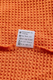 Haut en tricot gaufré color block léopard orange