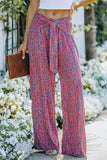 Pantalon large à petites fleurs et imprimé floral noué sur le devant 