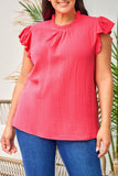 Blouse texturée froissée rose à manches bouffantes et à volants