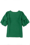 Blouse verte à pois suisses à manches doubles bouffantes