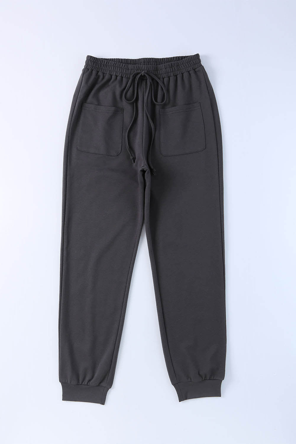 Pantalon de jogging noir avec cordon de serrage à la taille et poches plaquées sur le devant 