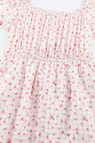 Robe florale rose à taille élastique et ourlet à volants