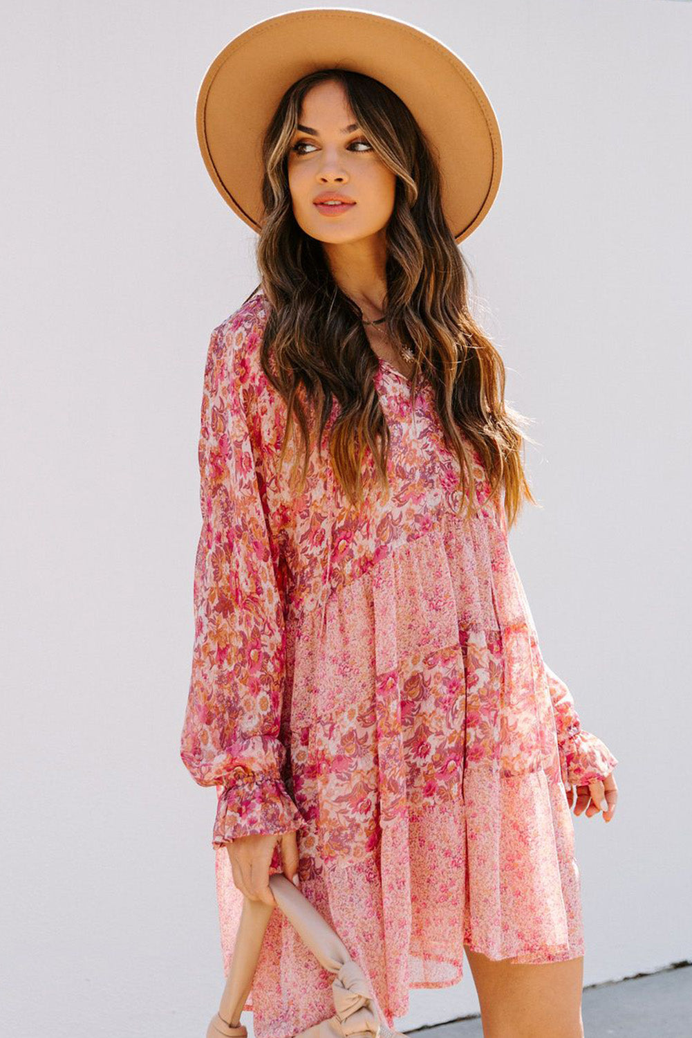 Robe rose à imprimé floral et manches bouffantes