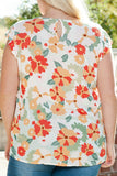 Blouse rose à imprimé floral et à volants et manches flottantes