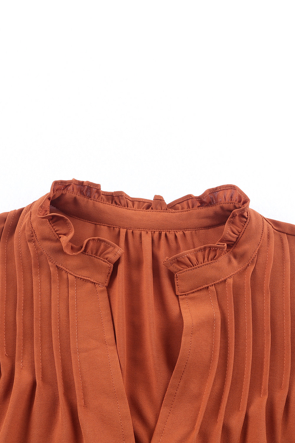 Blouse orange plissée à volants et boutonnée à col en V