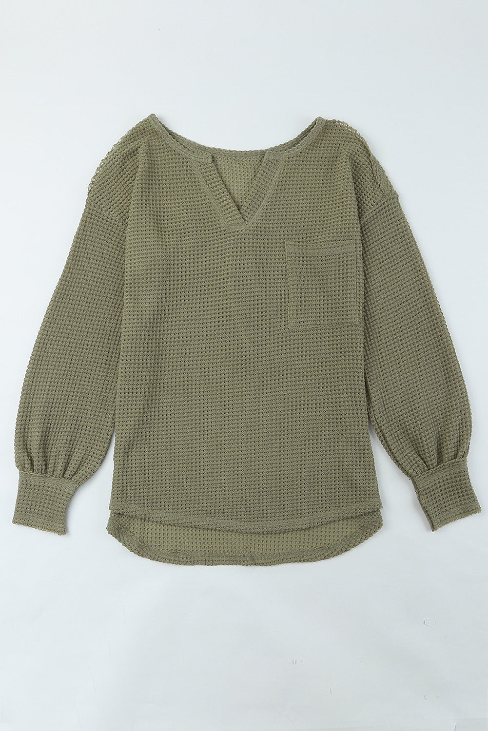 Haut ample beige en tricot gaufré avec poches et col fendu