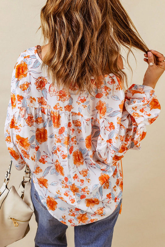 Blouse dolman orange fendue à col en V et imprimé floral 