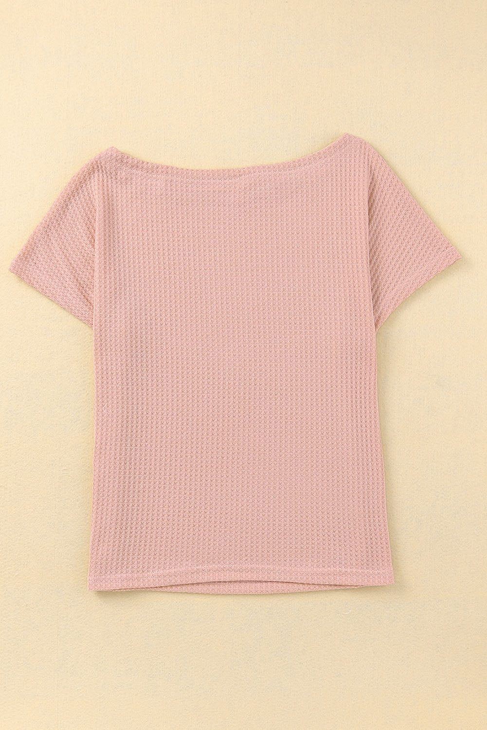 Haut en tricot gaufré rose à col large et droit