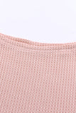 Haut en tricot gaufré rose à col large et droit