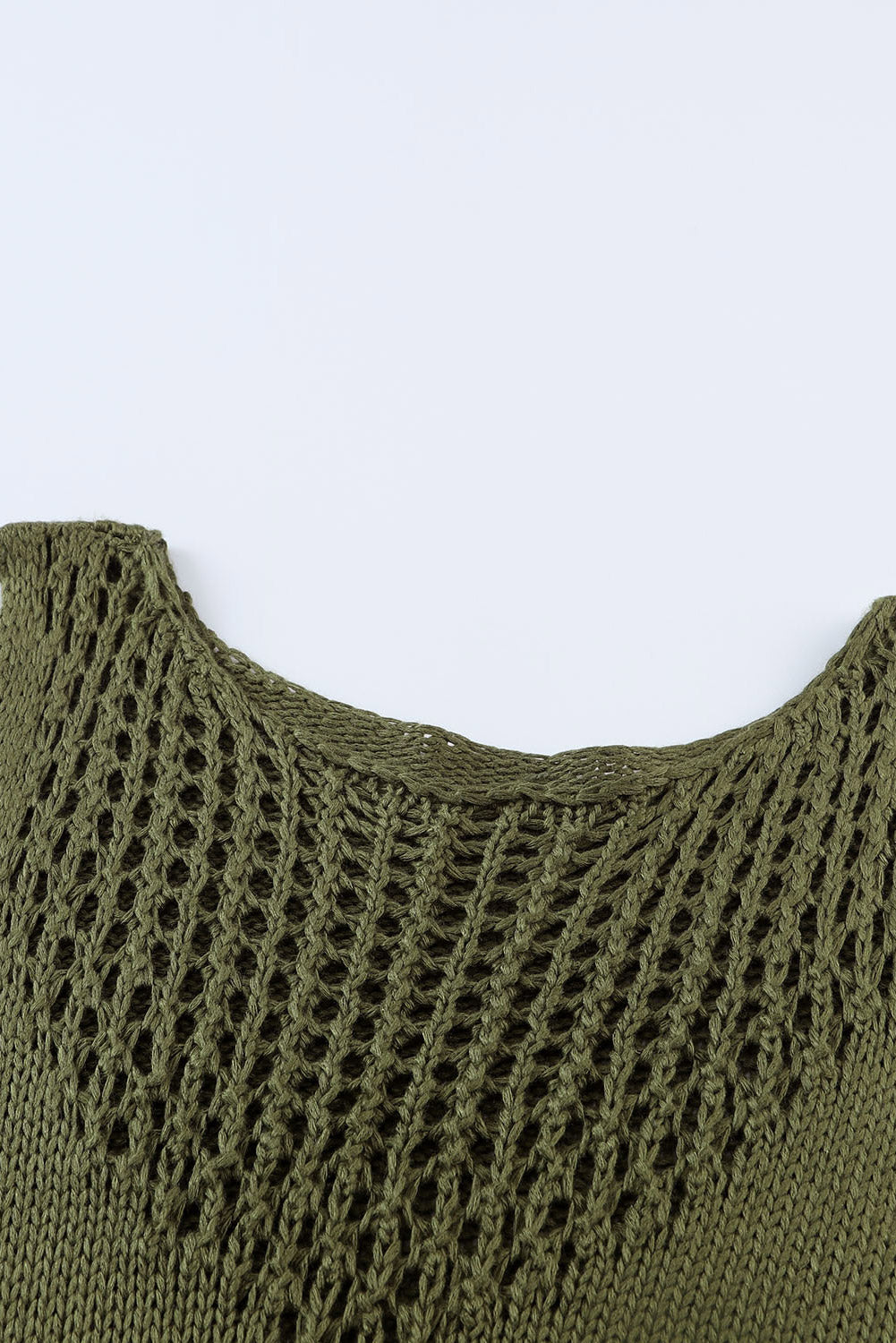 Débardeur vert en tricot ajouré au crochet à glands