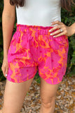 Short rose à taille smockée et imprimé floral