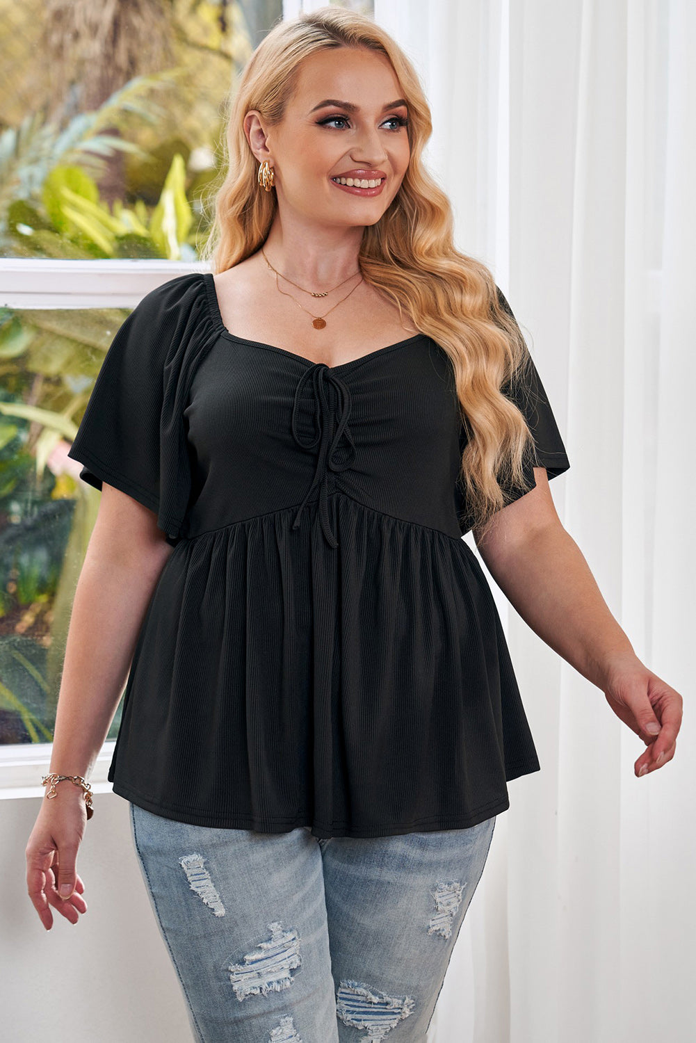 Haut babydoll noir froncé sur le devant de grande taille