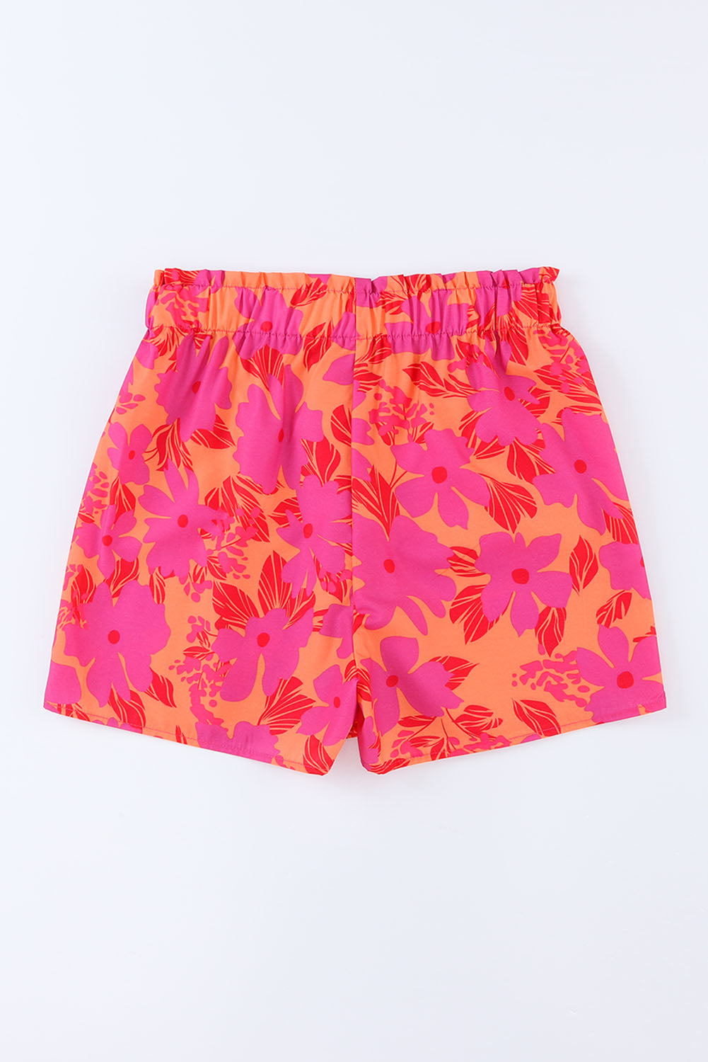 Short rose à taille smockée et imprimé floral