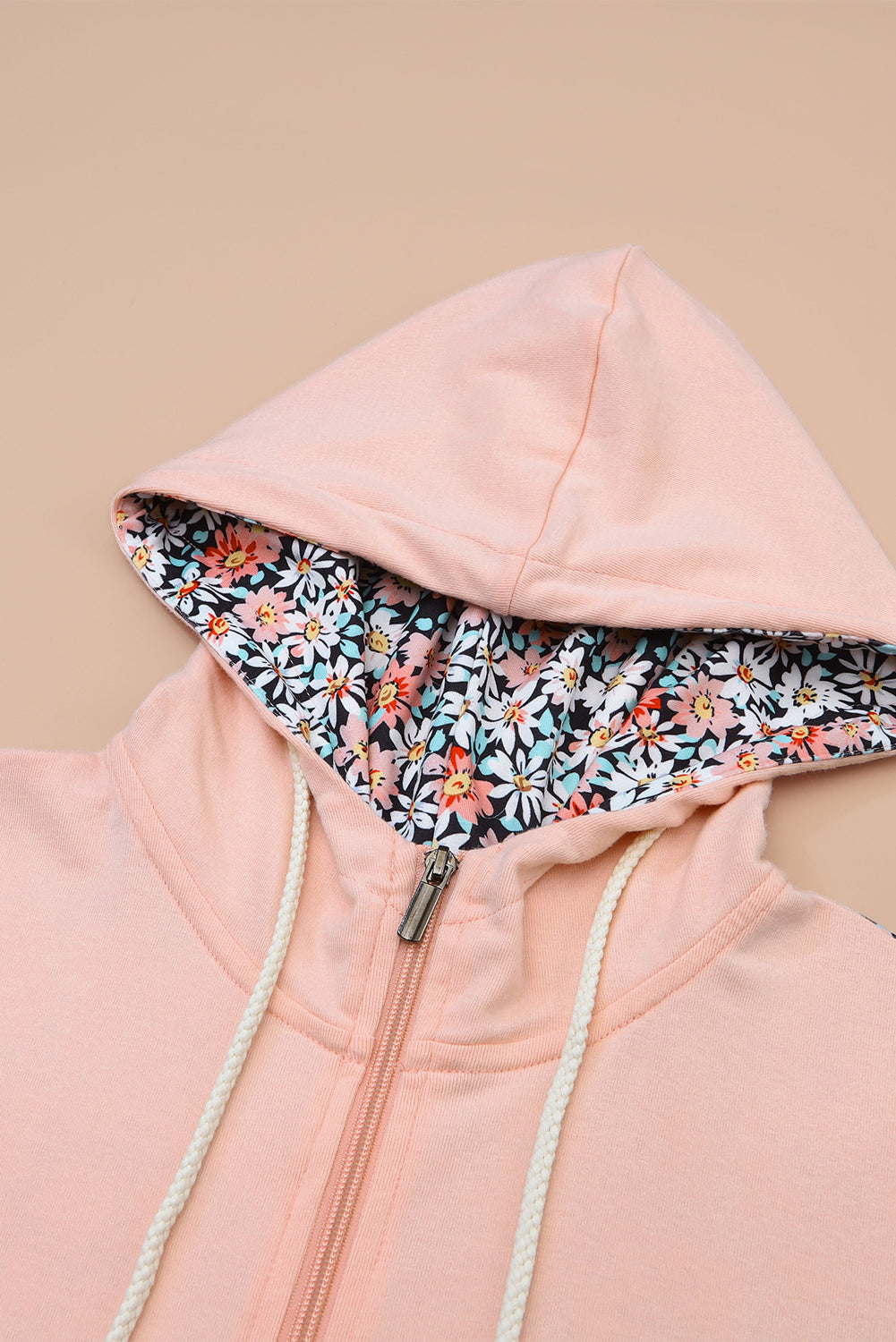 Sweat à capuche rose avec poche kangourou et patch floral à demi-zip