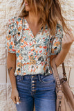 Blouse multicolore fendue à col en V et manches bouffantes à imprimé floral