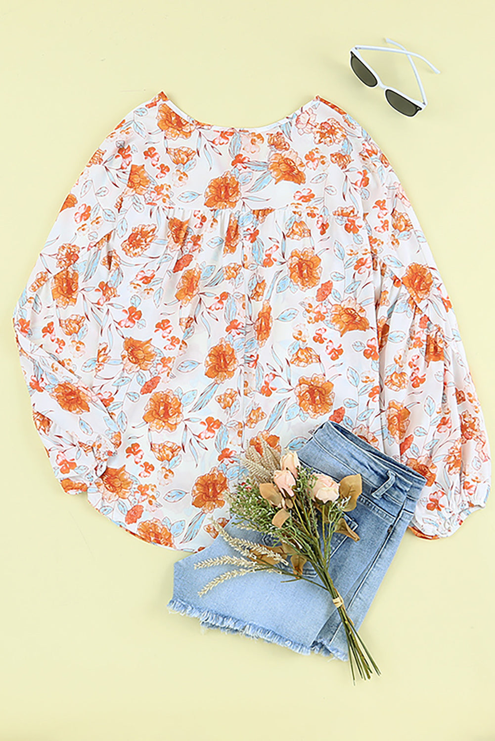 Blouse dolman orange fendue à col en V et imprimé floral 