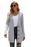 Cardigan gris avec poche avant et fermeture à boutons