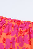 Short rose à taille smockée et imprimé floral