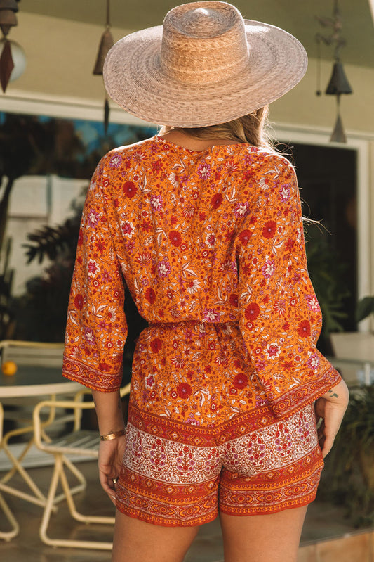 Barboteuse portefeuille florale style Boho orange, col en V, taille nouée 