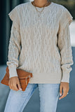 Pull beige en tricot torsadé avec épaules volantées