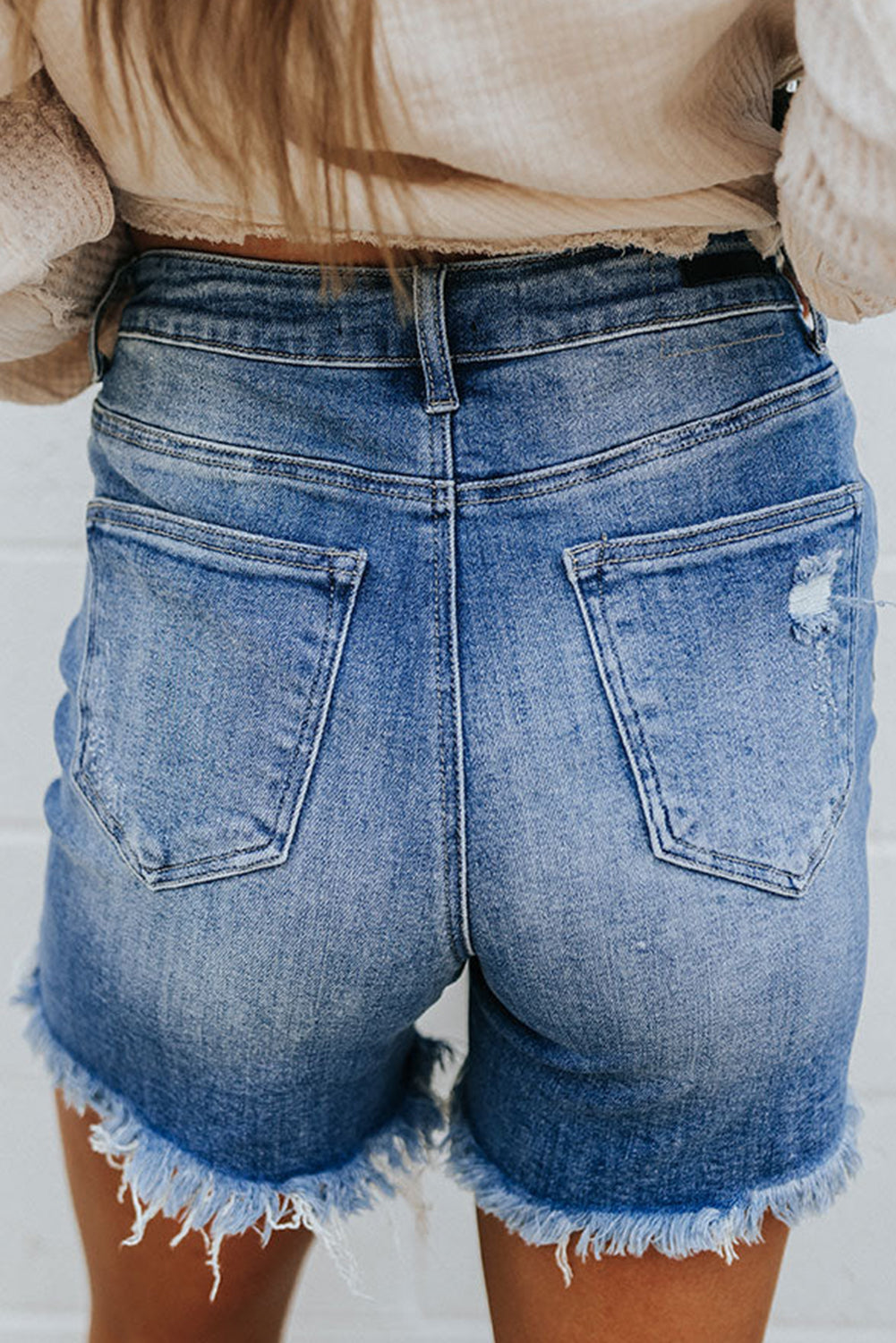 Short bleu taille haute en détresse à franges coupé 