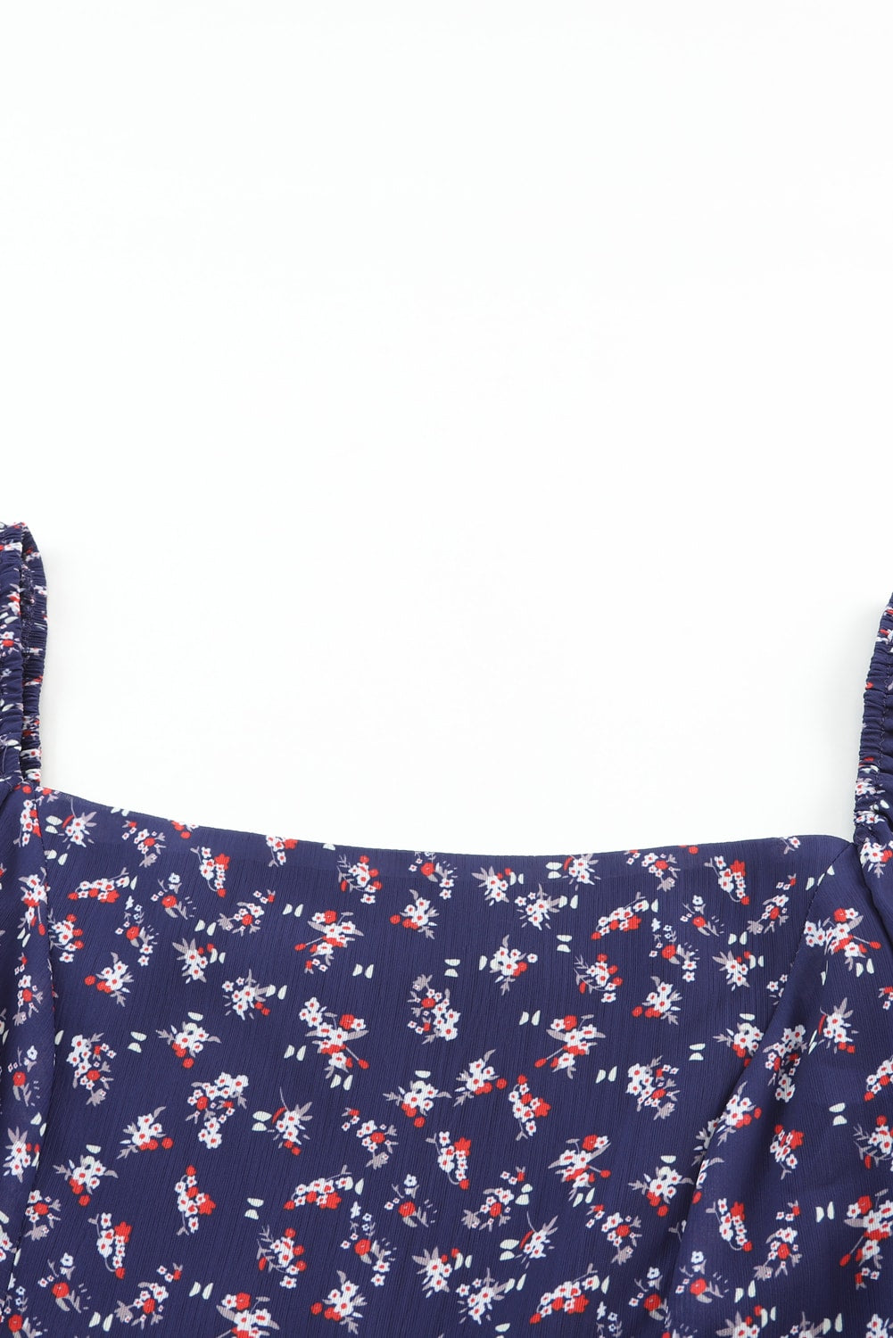 Robe bleue smockée à imprimé floral et manches bouffantes à col carré