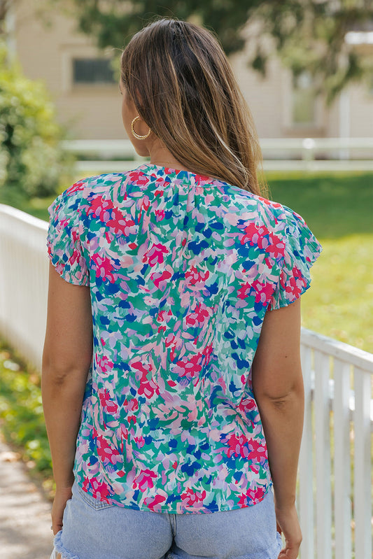 Blouse florale plissée à manches flottantes et col en V bleu ciel