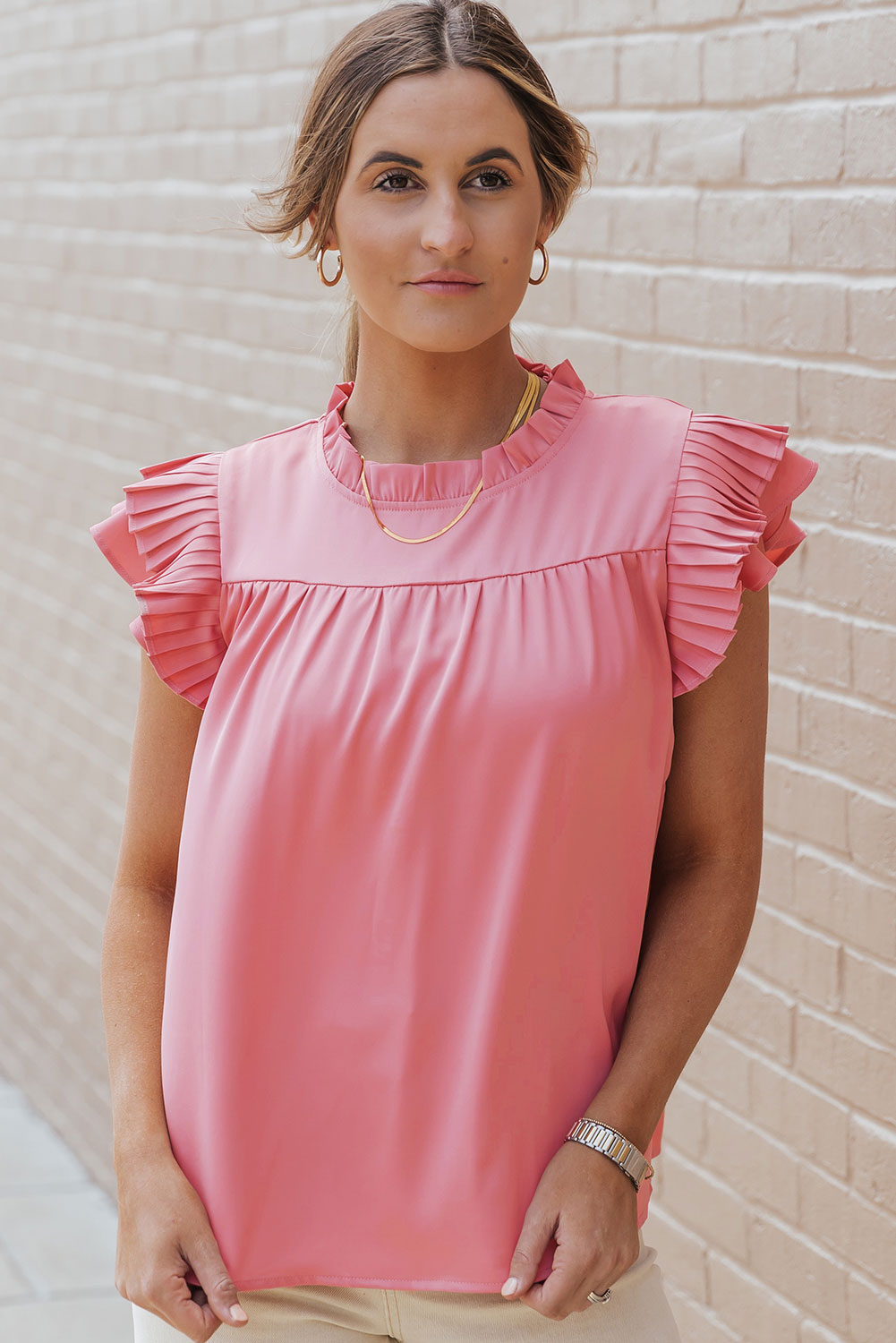 Blouse rose en satin à manches volantées et à franges