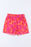 Short rose à taille smockée et imprimé floral