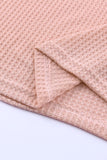 Haut en tricot gaufré rose à col large et droit