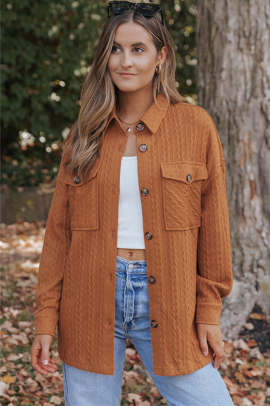 Veste longue orange en tricot texturé avec poche à rabat surdimensionnée