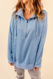 Sweat-shirt bleu ciel avec poches et demi-zip en coton