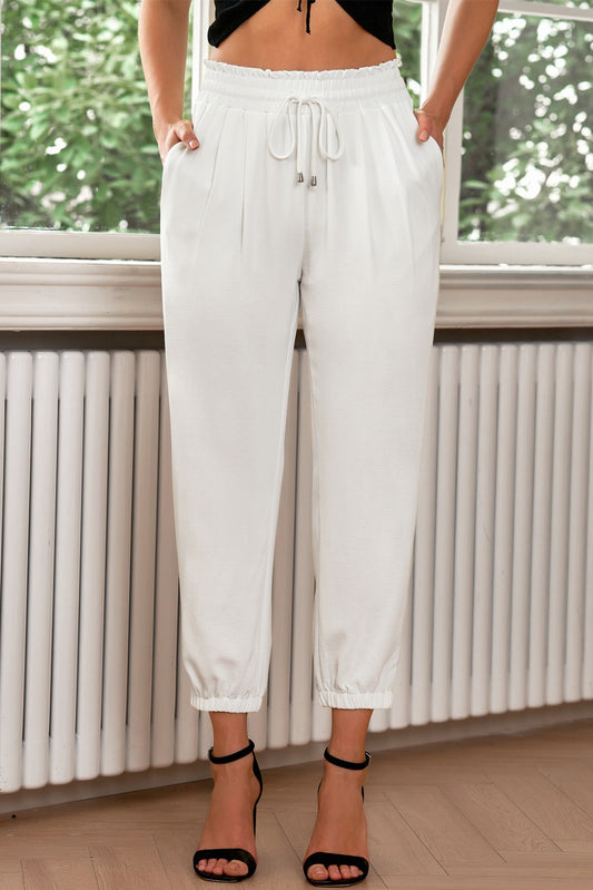 Pantalon de jogging blanc à taille smockée avec cordon de serrage et couleur unie