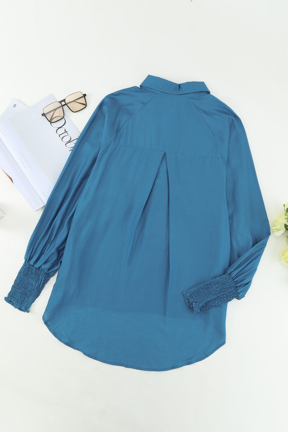 Chemise bleue à poches et manches bouffantes