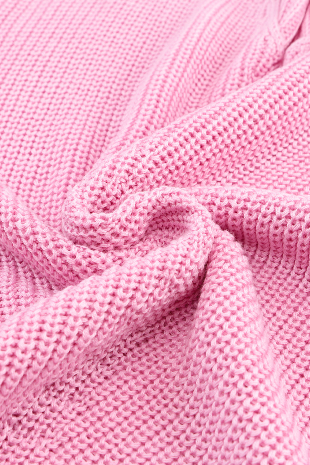 Pull rose en maille côtelée à col en V