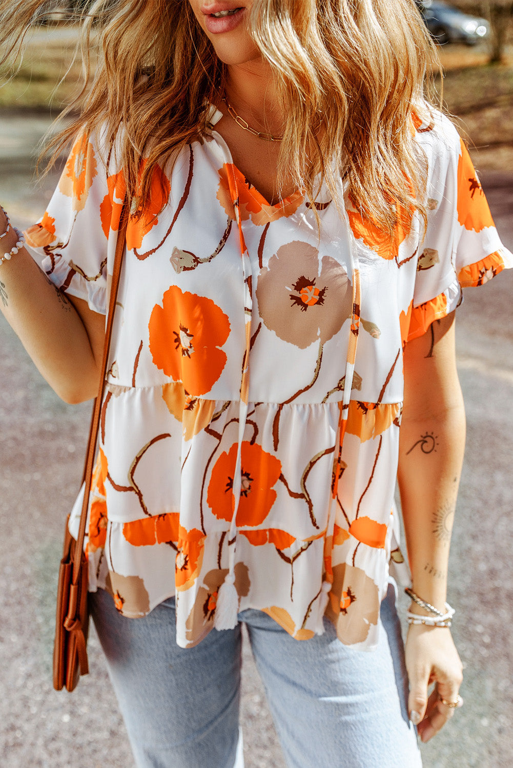 Blouse babydoll orange à imprimé floral et col volanté 