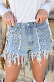 Short en jean bleu ciel avec empiècement à sequins et ourlet à pampilles effiloché