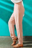 Pantalon taille haute rose à volants et ceinture élastique