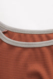 Blouse orange en tricot gaufré à manches longues léopard avec nœud torsadé