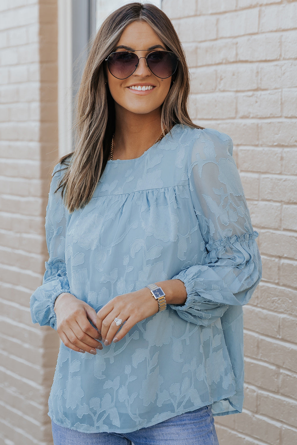 Blouse babydoll bleue texturée à volants et manches lanternes